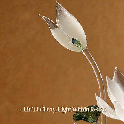 Glass flower sculpture with a brown background and text 'Liu'LI Clarity, Light Within Reach'.