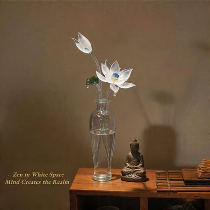 Clear vase with glass flowers on a wooden table with a Buddha statue and text overlay.