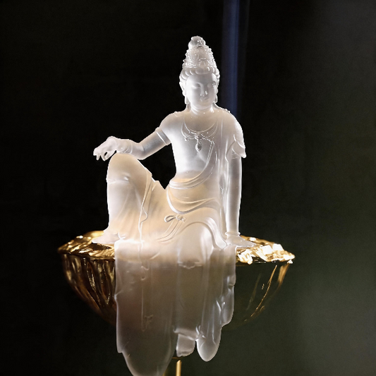 White Buddha statue on a dark background