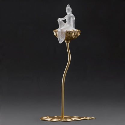 Decorative lamp with a Buddha figure on a dark background