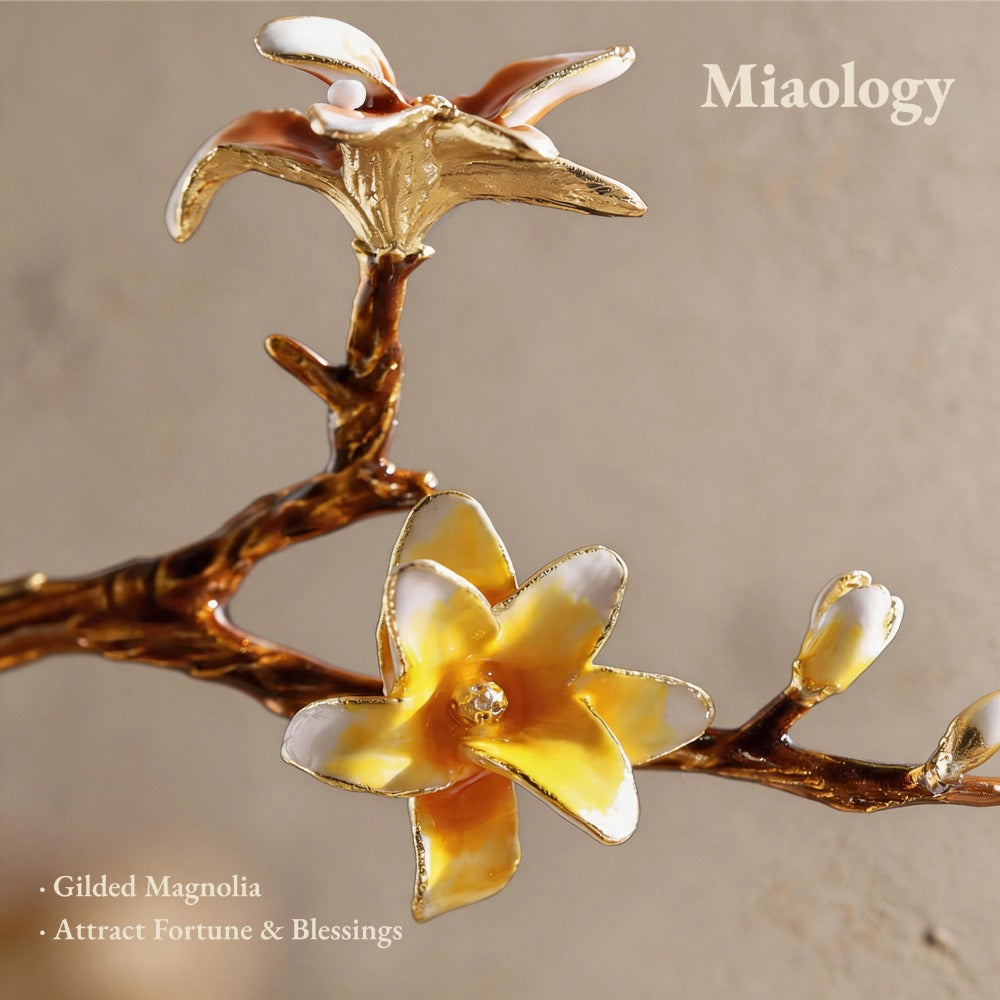 Gold flower ornament with 'Miaology' branding on a beige background