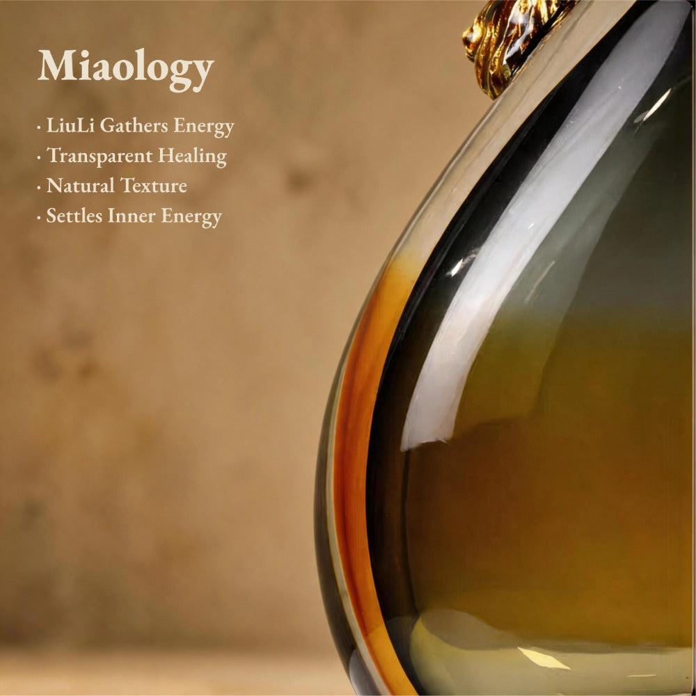 Amber pendant with gold accents on a blurred background, featuring text about Miaology's product benefits.